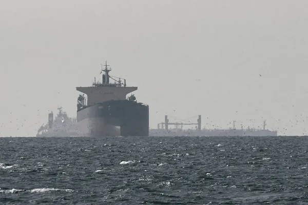Two Ships Sink Near Strait of Hormuz as Iran Escalates Attacks on Shipping